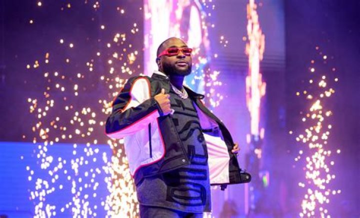 "This is Beautiful": Video of Davido's Dad Carrying One of the Singer's Twins At an Event Goes Viral